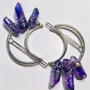 Pair of moon-shaped silver hair clips with purple crystal stones in bohemian style