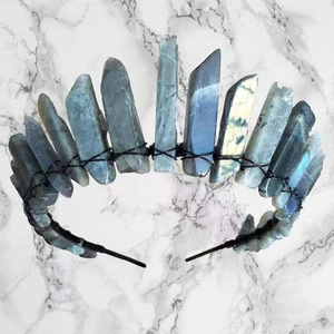 Detail of natural grey labradorite stones hand-wrapped on a black metal bridal crown headband