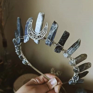 Detailed view of handcrafted moon crown with grey raw crystals and wire-wrapped metal base