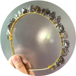Handmade golden headband featuring natural dark grey raw crystals in bohemian style
