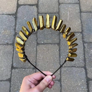 Detail of handmade golden crystal tiara with raw mineral stones on a metal headband