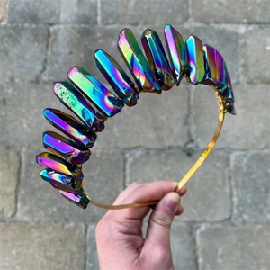 Close-up of rainbow aura crystal crown with gold wire wrapping on metal headband