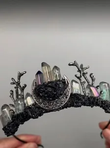Macro shot of gothic crown detail with crystal stones, metal moon and tree branch textures