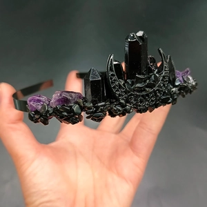 Detailed close-up of Gothic black crystal moon crown with raw amethyst stone details
