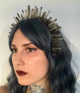 Detail of a handmade bridal crown featuring natural smoky quartz crystals on a black headband