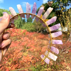 Detail of handcrafted lavender crystal crown featuring raw amethyst on a golden wire headband