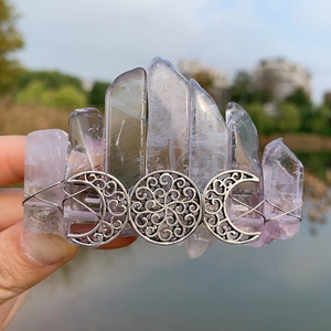 Detail of bohemian triple moon symbol on crystal hair clip with lavender quartz stones