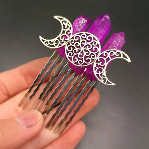 Macro view of purple crystal moon hair comb with intricate silver metal filigree details