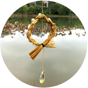 Handmade woven dreamcatcher wind chime with purple amethyst stones and rainbow crystal prism