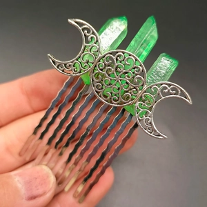 Detailed close-up of Triple Moon silver hair comb featuring green crystal clusters