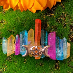 Detail showing colorful crystal points and moon star charm on a bohemian hair clip