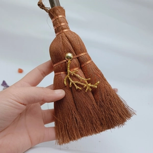 Detail of wicca mini broom car charm with crystal accents and rustic jute hanging rope