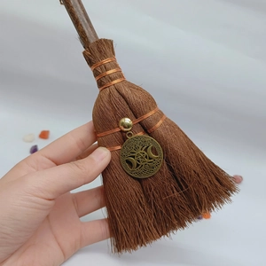 Detail of wicca mini broom car charm with bronze goddess pentagram and natural crystal