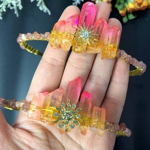 Bohemian sun goddess crown with pink crystal shards and gold wire wrap on hand