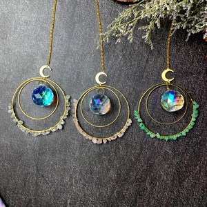 Three-piece natural crystal suncatcher set with golden moon and hanging prisms