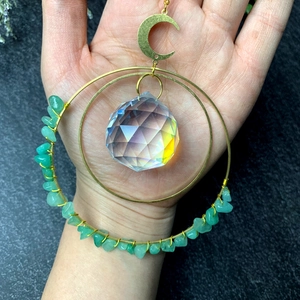 Handmade crystal wind chime with green gemstones, moon pendant and golden metal rings