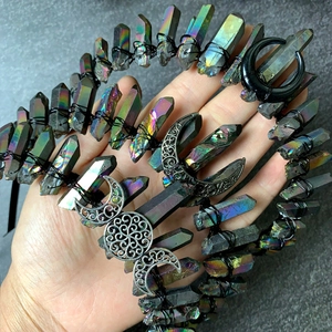 Close-up of aura crystal crown with iridescent quartz and silver triple moon symbol