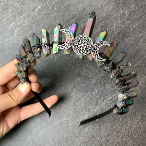 Detailed macro view of Aura Quartz crystals and moon charms hand-wired on a black crown