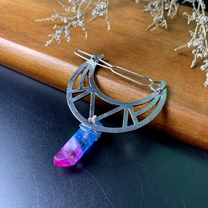 Detail of silver moon hair clip with wire-wrapped gradient crystal and boho design