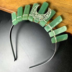 Handmade crown headband featuring green crystal rectangles and a silver crescent moon charm