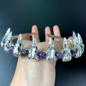Detail of gothic raven skull headband with purple amethyst beads and silver wire wrapping
