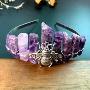 Close-up of handmade amethyst crown headband with silver bee and wire-wrapped crystals