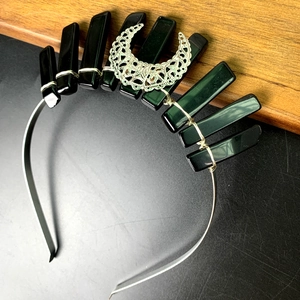 Handmade crown headband featuring dark green raw crystals and silver crescent moon charm
