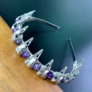 Detail of gothic raven skull headband with purple crystal beads and handmade wire wrap