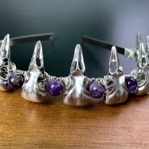 Detail of gothic raven skull headband with purple crystal beads and silver metal craft