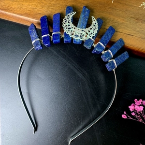 Detail of handcrafted silver headband featuring moon charm and blue raw crystals