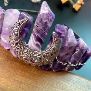Detail of amethyst raw stone headband with a hollow silver moon and wire-wrapped design