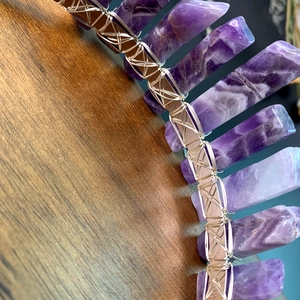 Close-up of handmade crown showing purple crystal points with silver wire wrap detail