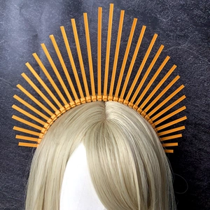 Detailed view of sunburst halo crown headband with golden spikes for costume photography