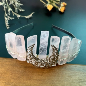 Detailed view of handmade rose quartz crescent moon headband with intricate wire wrapping