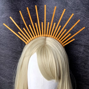 Macro detail of the orange sunburst halo crown made with radiant plastic ties