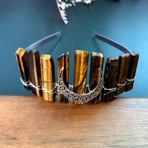 Detailed view of tiger eye stones and silver moon pendant hand-wired on the headband