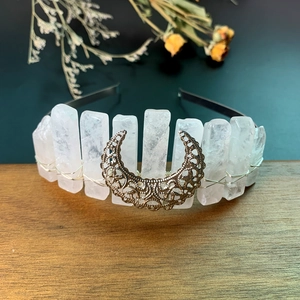 Macro shot of white crystal quartz points and vintage gold moon on handmade headband