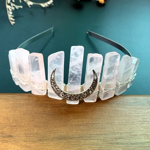 Handmade rose quartz crown with silver moon charm and crystal stones on a metal headband