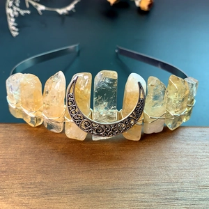 Close-up of handmade citrine crystal crown with vintage silver moon and wire wrapping