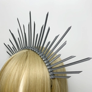 Detail of silver spiked halo crown headband with gothic industrial zip tie design