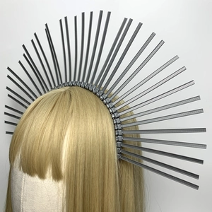 Detail of silver halo crown featuring textured industrial gothic spikes on a slim headband