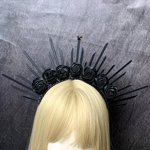 Gothic black rose halo headband with spikes and star detail on mannequin head