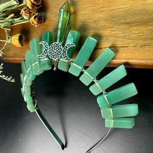 Detail of green raw crystal crown with silver triple moon goddess on black headband
