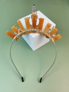 Detail of handcrafted silver bee crown headband with orange crystals and filigree art