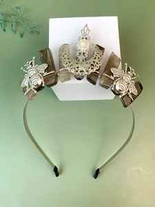Detail of bohemian silver crown headband featuring raw quartz, metallic bees and moon