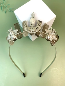 Macro shot of silver bee crown with moon pearl and natural smoky quartz crystals