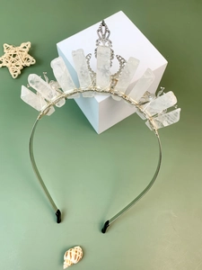 Detail of handmade white crystal crown headband with silver filigree and wire wrapping