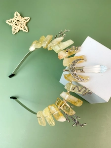 Macro detail of natural crystals and moon charm on a handmade bohemian crown