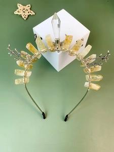 Detailed craftsmanship of crown headband with yellow raw stones and silver branches