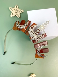 Detail of bohemian moon crown headband with brown crystals and silver wire wrapping